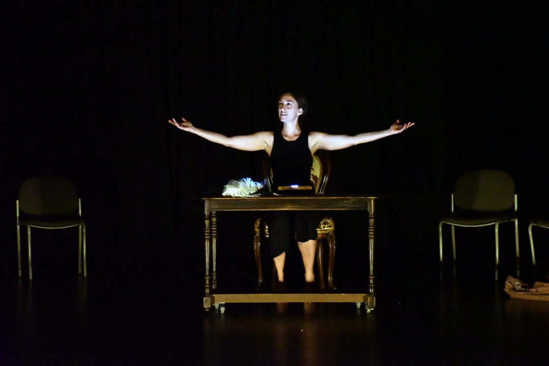 woman with arms outstretched