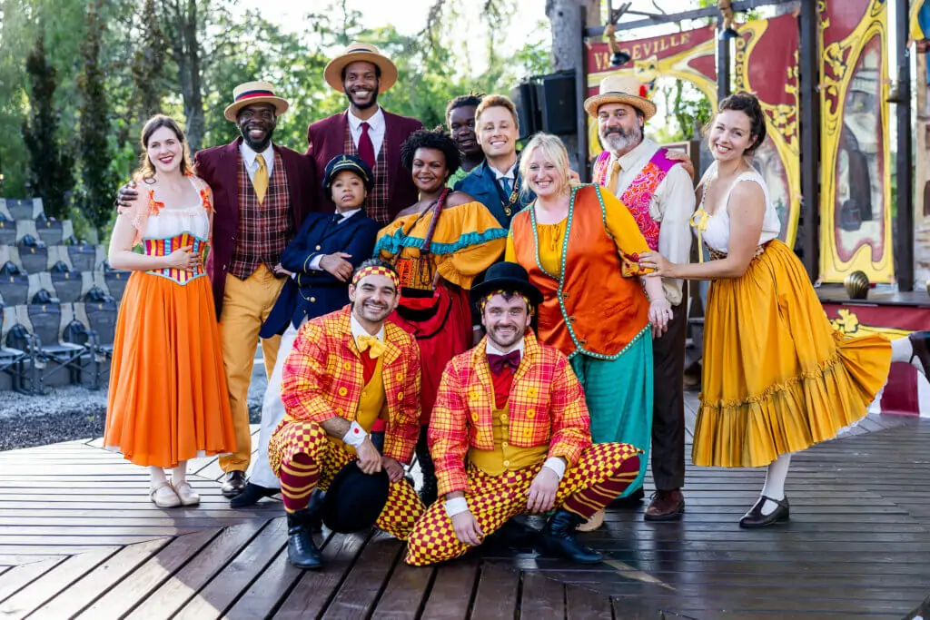 a group of actors wearing vaudeville costumes